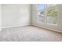 Spacious bedroom with neutral walls and carpet at 8061 Valley Farms Trl, Indianapolis, IN 46214