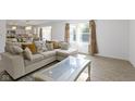 Open living room with sectional sofa and coffee table at 10125 Caprock Canyon Dr, Indianapolis, IN 46229