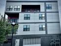 Multi-story building with gray and dark gray panels and multiple windows at 150 S Main St # 302, Franklin, IN 46131