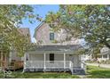 Renovated two-story home with a front porch at 248 N Walcott N St, Indianapolis, IN 46201