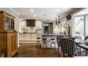 Bright kitchen features white and dark cabinets, herringbone backsplash, and stainless steel appliances at 7575 Central Ave, Indianapolis, IN 46240