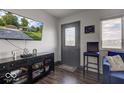 Bright living room with comfy blue sofa and large TV at 17128 Towne Rd, Westfield, IN 46074