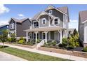 Two-story house with gray siding, white trim, and a front porch at 15551 Heatherbank Dr, Westfield, IN 46074