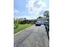 Brick ranch home with 2-car attached garage and manicured lawn at 2041 Radcliffe Ave, Indianapolis, IN 46227