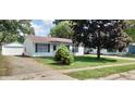 Ranch home with attached garage and neat landscaping at 3533 N Taft Ave, Indianapolis, IN 46222