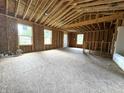 Spacious and bright interior with large windows and high ceilings at 207 N Birchwood Dr, Muncie, IN 47304