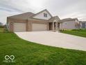 3-car garage and a spacious front yard at 2261 Pine Valley Dr, Plainfield, IN 46168