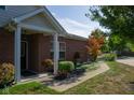 Brick ranch home with landscaped front yard and walkway at 5213 Dunewood Way, Avon, IN 46123