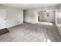 Spacious living room with neutral carpeting and natural light at 4013 N Graham Ave, Indianapolis, IN 46226