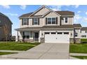 Two-story house with a neutral color scheme, stone accents, and a two-car garage at 4168 Dutton Dr, Bargersville, IN 46106