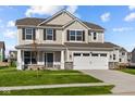 Two-story house with neutral siding, stone accents, and a large front yard at 4168 Dutton Dr, Bargersville, IN 46106