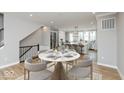 Bright dining area with a marble table and seating for six at 7284 County Road 600 W, McCordsville, IN 46055