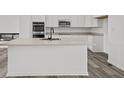 Modern kitchen with white cabinets, quartz countertops, and stainless steel appliances at 4190 Douro Trl, Westfield, IN 46062