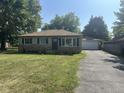 Ranch house with attached garage and lawn at 3509 Campbell St, Plainfield, IN 46168