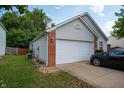 Attached garage with white door at 40 Bixler Rd, Indianapolis, IN 46227