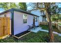 Quaint purple house with wooden fence and small patio at 215 N Randolph St, Indianapolis, IN 46201