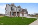Two-story home with gray siding, three-car garage, and a well-manicured lawn at 4959 Amber Crest Dr, Brownsburg, IN 46112