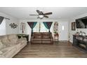 Bright living room with hardwood floors and comfortable furniture at 941 N 500 W, Columbus, IN 47201