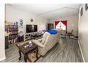 Spacious living room featuring a large sofa and flat-screen TV at 4620 Whitham Ln, Indianapolis, IN 46237