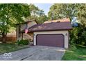 Two-story house with a large yard and attached garage at 7932 Eagle Valley Pass, Indianapolis, IN 46214