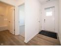 Bright entryway with hardwood floors and coat closet at 231 Lar Lan Dr, Danville, IN 46122