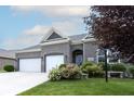 Brick house with two-car garage at 6611 Ventnor Pl, Indianapolis, IN 46217