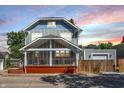 Two-story house with a front porch and detached garage at 1938 E 11Th St, Indianapolis, IN 46201