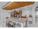 Modern kitchen with granite countertops and stainless steel appliances at 10660 Manor Dr, Brownsburg, IN 46112