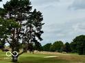 View of a golf course with trees, sand trap, and green at 980 Paris Dr, Franklin, IN 46131