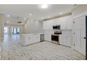 Modern kitchen featuring white cabinets, stainless steel appliances, and an island at 2841 Grandview Ln, Greenwood, IN 46143