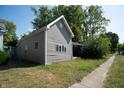 Gray siding house with side yard at 2363 N Gale St, Indianapolis, IN 46218