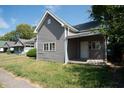 Gray siding house with front porch at 2363 N Gale St, Indianapolis, IN 46218