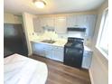 Kitchen with light blue cabinets and flooring at 2647 Sheffield Dr, Indianapolis, IN 46229