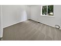 Spacious bedroom with neutral walls and carpet at 2647 Sheffield Dr, Indianapolis, IN 46229