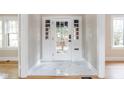 Bright entryway with marble flooring and a view through the front door at 3860 N Delaware St, Indianapolis, IN 46205