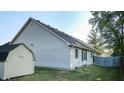 Rear view of house with shed and wooden fence at 709 Silver Fox Ct, Indianapolis, IN 46217