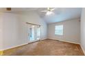 Spacious living room with vaulted ceiling and carpet at 709 Silver Fox Ct, Indianapolis, IN 46217