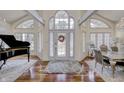 Spacious entryway with hardwood floors, large windows, and formal dining area at 5745 Paradise Dr, Martinsville, IN 46151