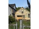 Backyard view with a partially visible home and basketball hoop at 1804 N Delaware St, Indianapolis, IN 46202