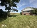 House nestled on a large lot with cornfield views at 1452 E Sr 234, Greenfield, IN 46140