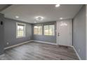 Light gray living room with new flooring and updated windows at 3730 Prospect St, Indianapolis, IN 46203
