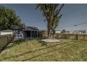 Charming gray house with a large tree in front at 3730 Prospect St, Indianapolis, IN 46203