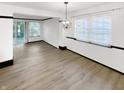 Spacious dining area with hardwood floors and a chandelier at 3213 Oceanline E Dr, Indianapolis, IN 46214