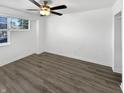 Simple bedroom with hardwood floors and a ceiling fan at 3213 Oceanline E Dr, Indianapolis, IN 46214