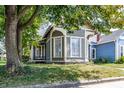 Gray and brown Victorian home with a charming front porch at 1715 Alabama St, Indianapolis, IN 46202