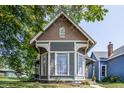 Gray and brown Victorian home with a charming front porch at 1715 Alabama St, Indianapolis, IN 46202
