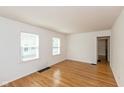 Simple living room featuring hardwood floors and neutral walls at 5648 N Keystone Ave, Indianapolis, IN 46220