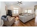 Spacious living room with hardwood floors, vaulted ceiling and a cozy seating area at 1569 Tupelo Dr, Greenfield, IN 46140