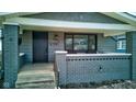 Inviting front porch with brick columns and seating at 385 S Arlington Ave, Indianapolis, IN 46219