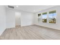 Spacious living room with vinyl flooring and multiple windows providing ample natural light at 2081 Covey Dr, Danville, IN 46122